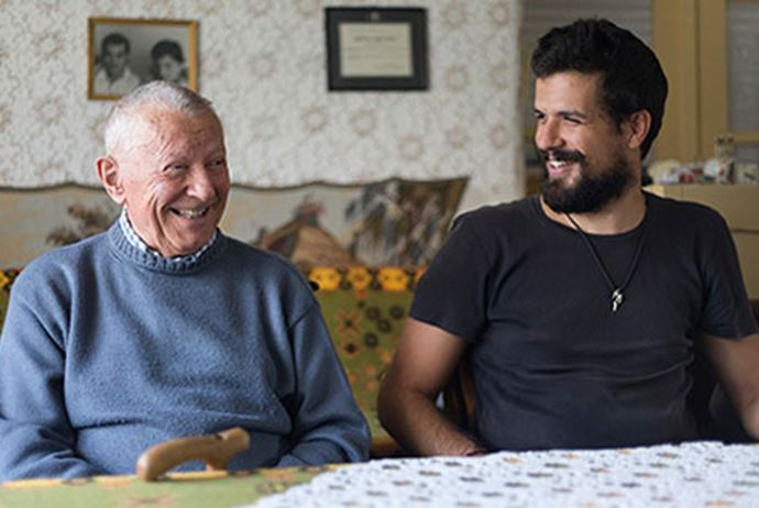 Grandfather and older grandson laughing